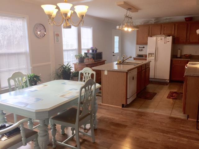 277 Autumn Road Morrison, TN 37357 - Photo 3 of 17 a kitchen with refrigerator a table and chairs