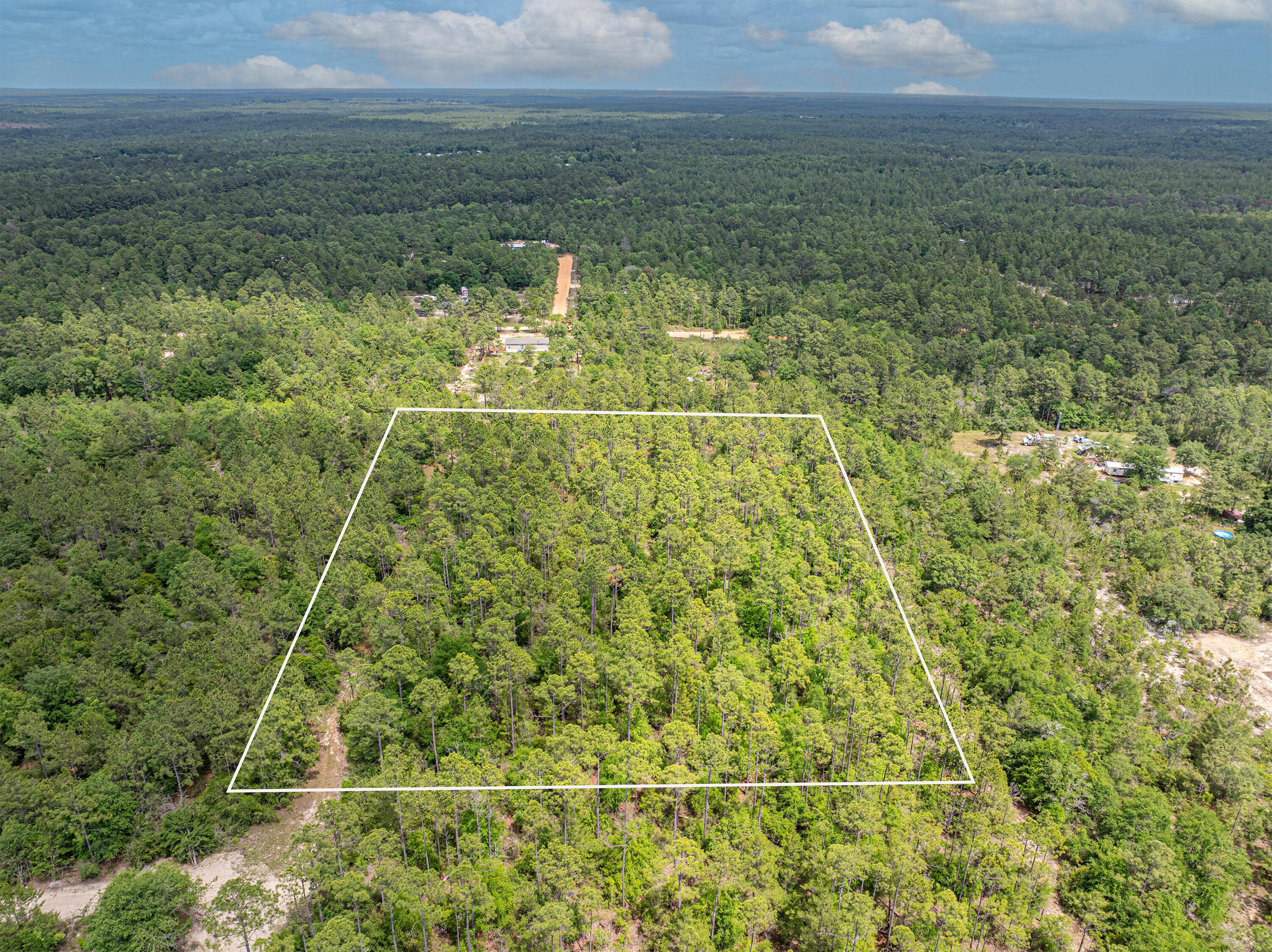 5-acres Coventry Road DeFuniak Springs, FL 32433 - Photo 2 of 4 a view of a yard