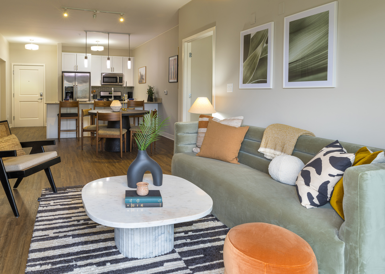 255 North Addison Avenue, Unit 654 Elmhurst, IL 60126 - Photo 11 of 23 a living room with furniture a dining table and kitchen view