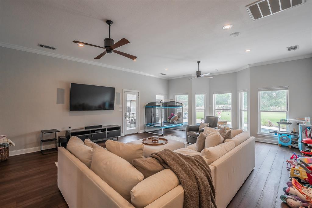 115 Pheasant Run Road Argyle, TX 76226 - Photo 23 of 40 a living room with furniture and a flat screen tv