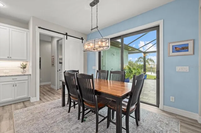 a dining room with furniture window and outdoor view