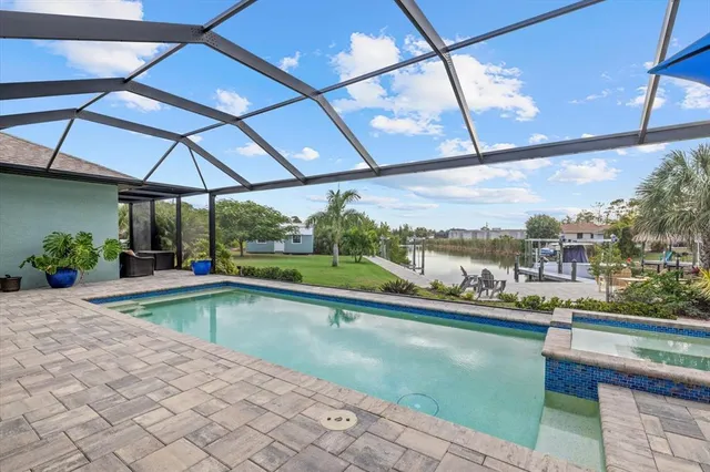 a view of a lake with couches and wooden floor