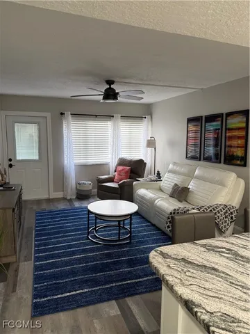 a living room with furniture and a table