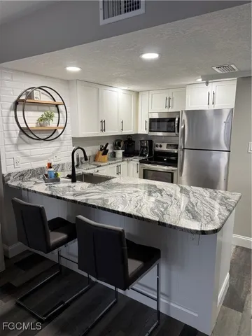 a kitchen with counter space cabinets and appliances