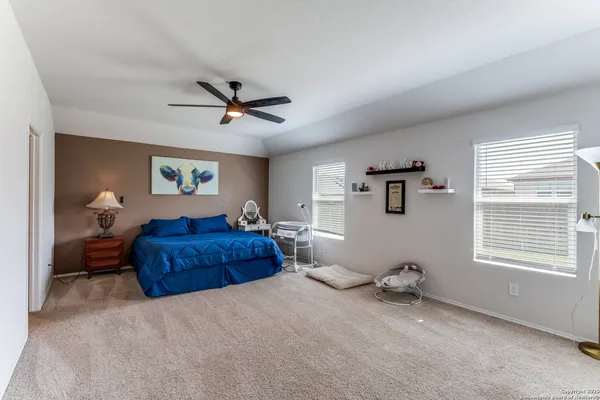 a living room with a bed furniture and a window