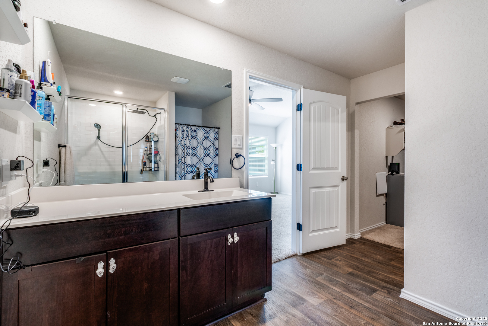 816 Indigo Way Seguin, TX 78155 - Photo 16 of 25 a bathroom with a double vanity sink mirror and shower