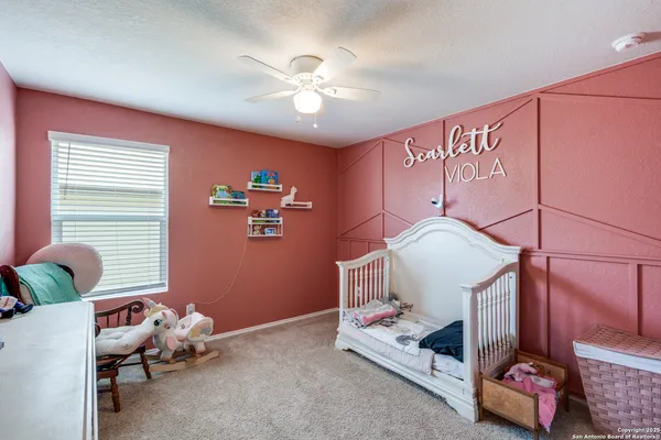 a bedroom with furniture and a chandelier