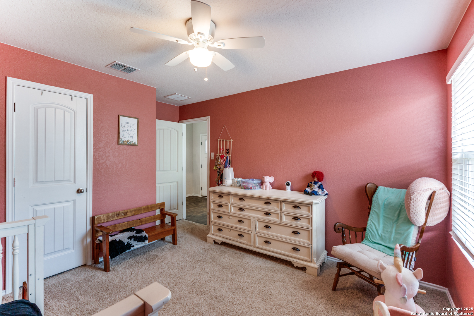 816 Indigo Way Seguin, TX 78155 - Photo 19 of 25 a bedroom with furniture and a chandelier