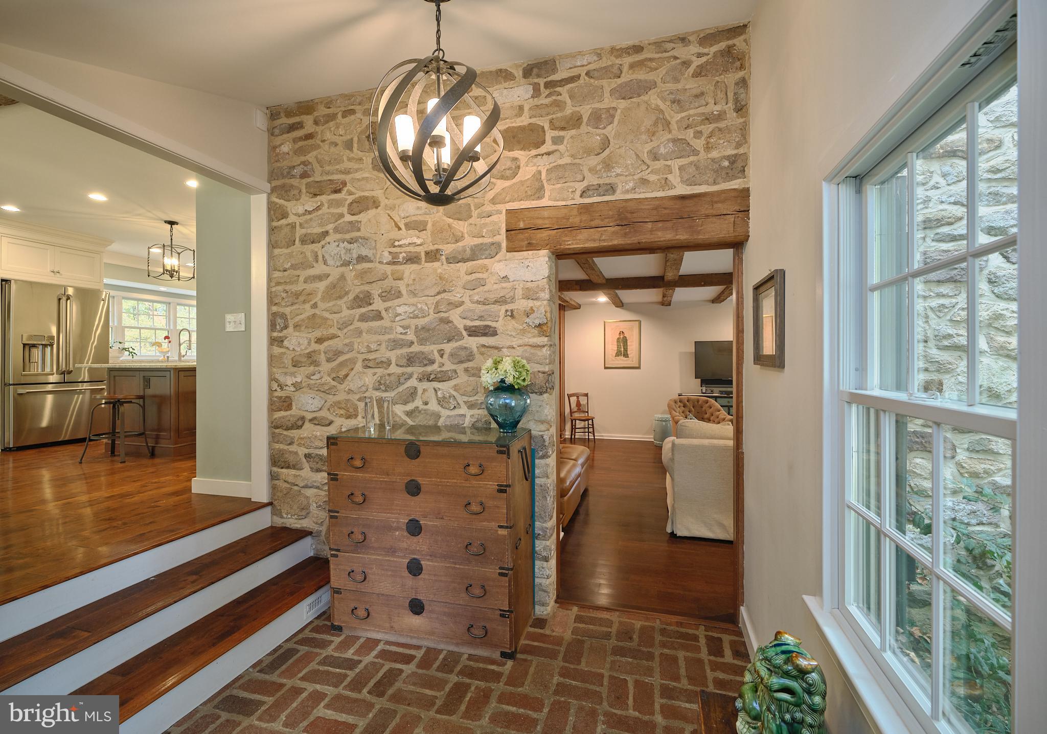 3515 Windy Bush Road New Hope, PA 18938 - Photo 4 of 41 Inviting Foyer w stone wall and brick flooring