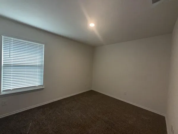 a living room with hard wood floors and a fireplace