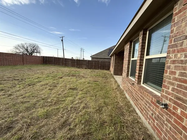 an empty room with a empty space and window