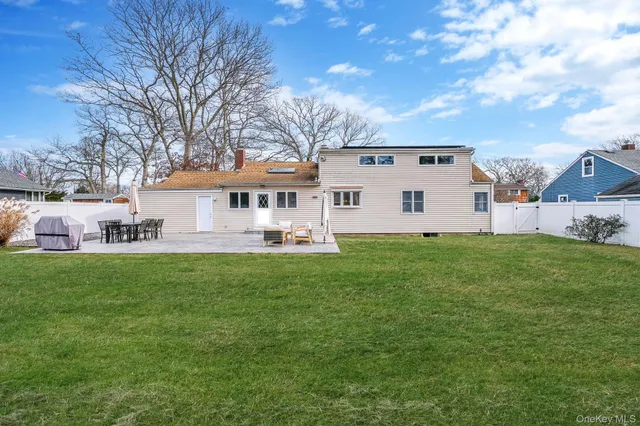 a view of a yard with furniture and a fire pit