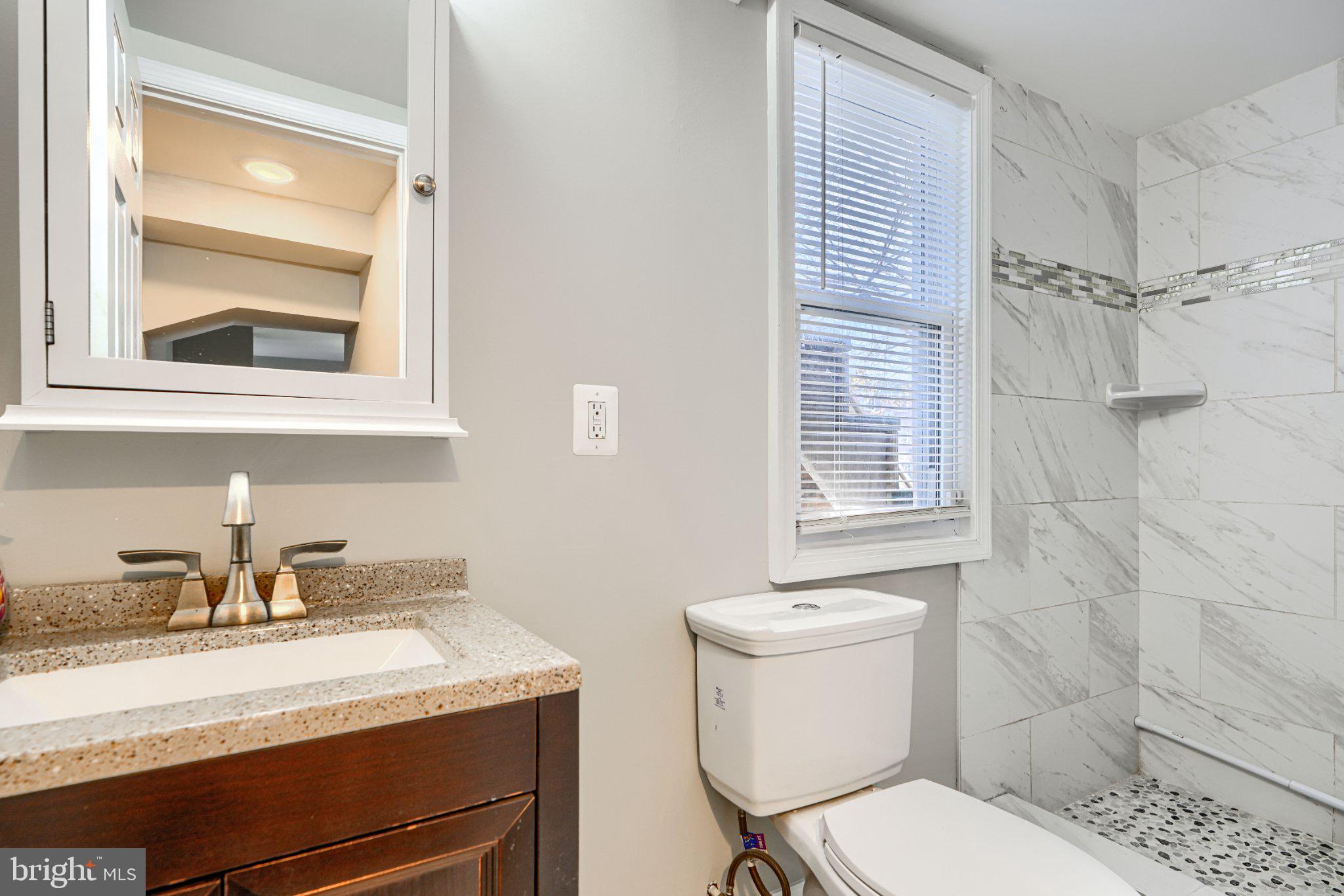3414 Alto Road, Unit 1 Baltimore, MD 21216 - Photo 16 of 18 Modern bathroom with elegant finishes.