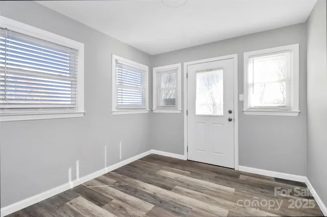 a view of a bathroom with a sink and a mirror