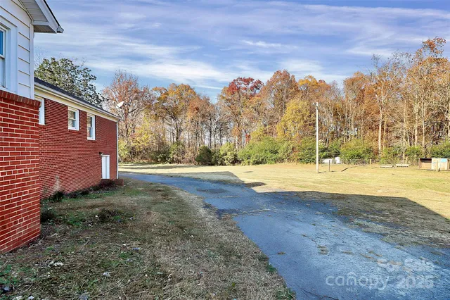 a backyard of a house with wooden fence