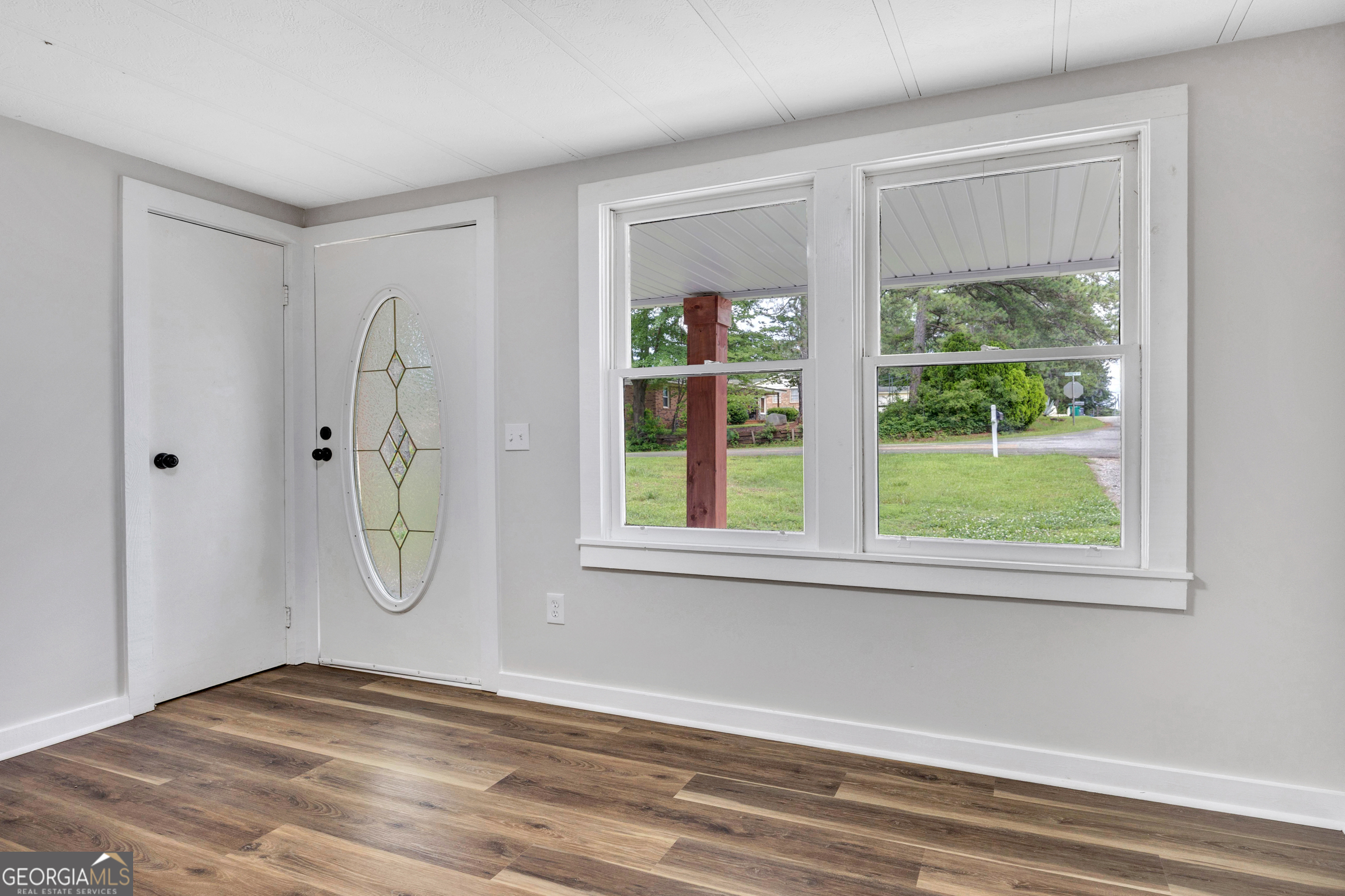 455 Cindy Street Jackson, GA 30233 - Photo 2 of 25 a view of a room with a window and ceiling fan