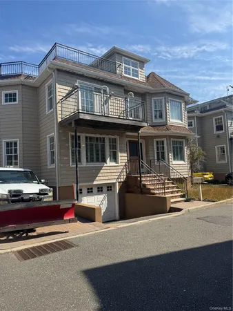 a front view of a house with a garage