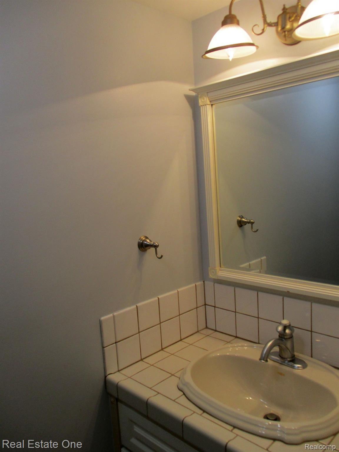 1685 Riverside Drive, Unit 7 Rochester, MI 48309 - Photo 14 of 24 Half Bath Vanity