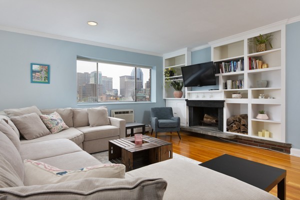 a living room with furniture fireplace and a flat screen tv