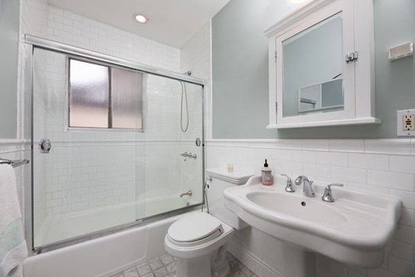 259 Beacon Street, Unit 71 Boston, MA 02116 - Photo 4 of 9 a bathroom with a sink toilet and shower
