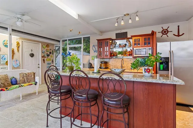 a dining room with furniture a rug and window