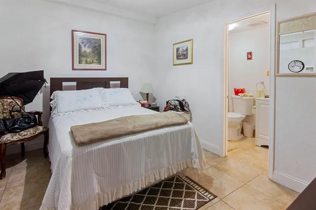 a bedroom with a bed and a cabinets