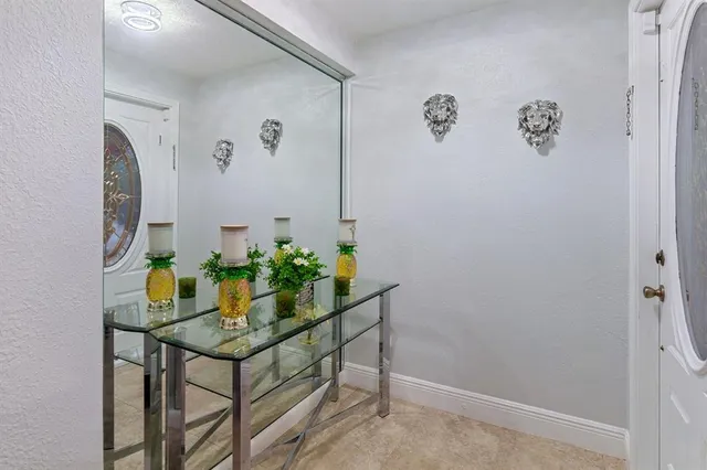 a room with table and potted plants
