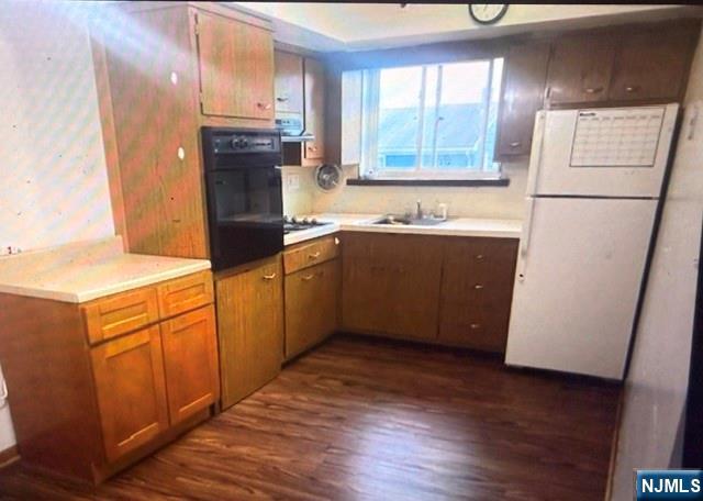 490 Union Avenue Rutherford, NJ 07070 - Photo 9 of 11 a kitchen with stainless steel appliances granite countertop a refrigerator a sink and a stove