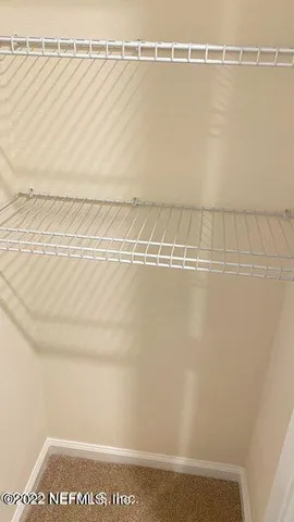 a view of a room with racks on the wall