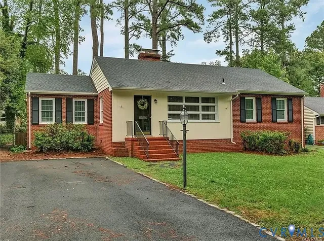 front view of a house with a yard