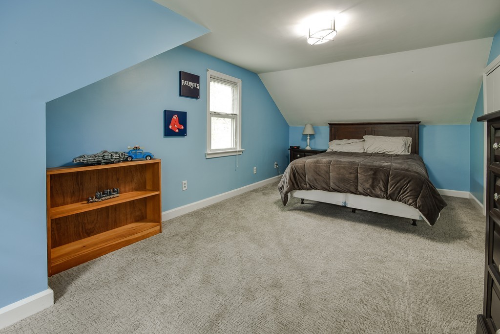 27 Stonebridge Road Wayland, MA 01778 - Photo 13 of 19 a bedroom with a bed and a window