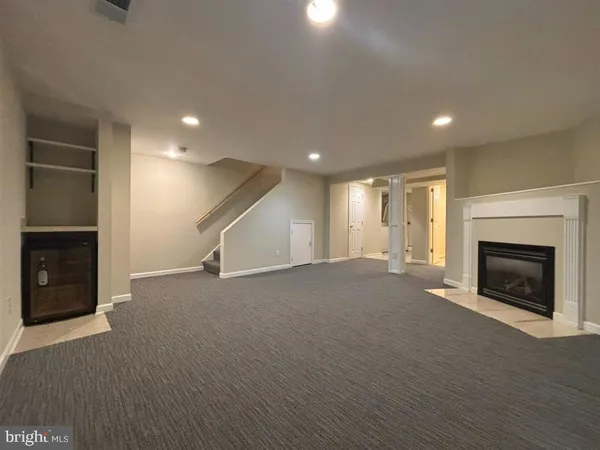 a view of an empty room with a fireplace