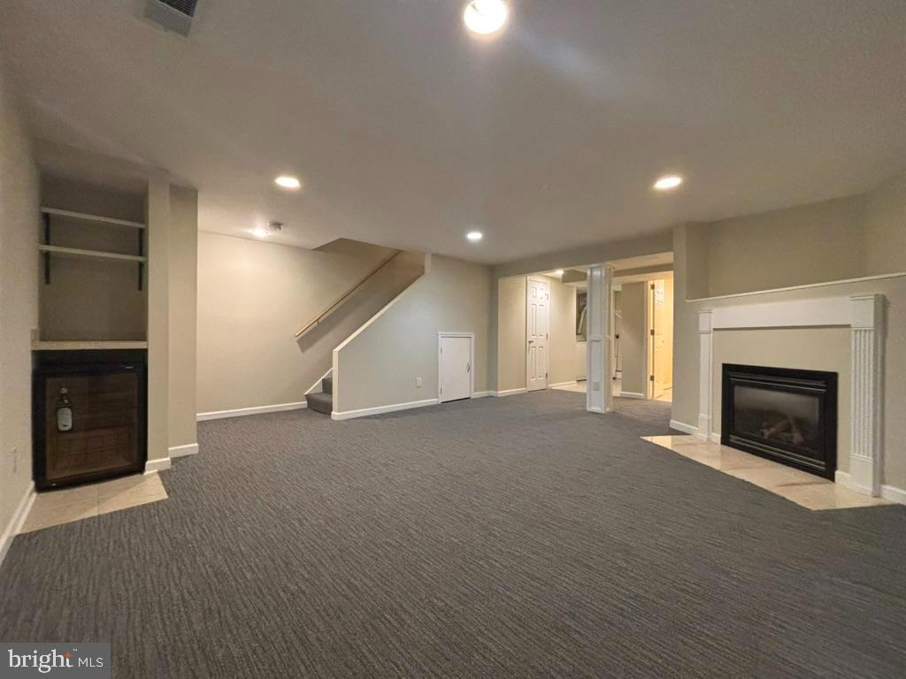 7028 Heathfield Road Baltimore, MD 21212 - Photo 20 of 23 a view of an empty room with a fireplace