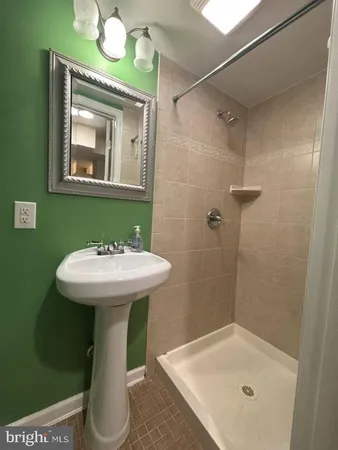 a bathroom with a sink a mirror and a toilet