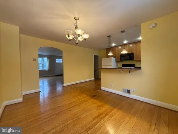 a view of a livingroom with a kitchen