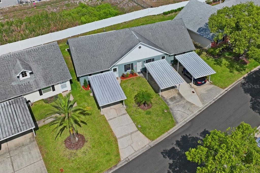 6101 Elmhurst Drive, Unit 5B New Port Richey, FL 34653 - Photo 27 of 45 an aerial view of a house with garden space and street view
