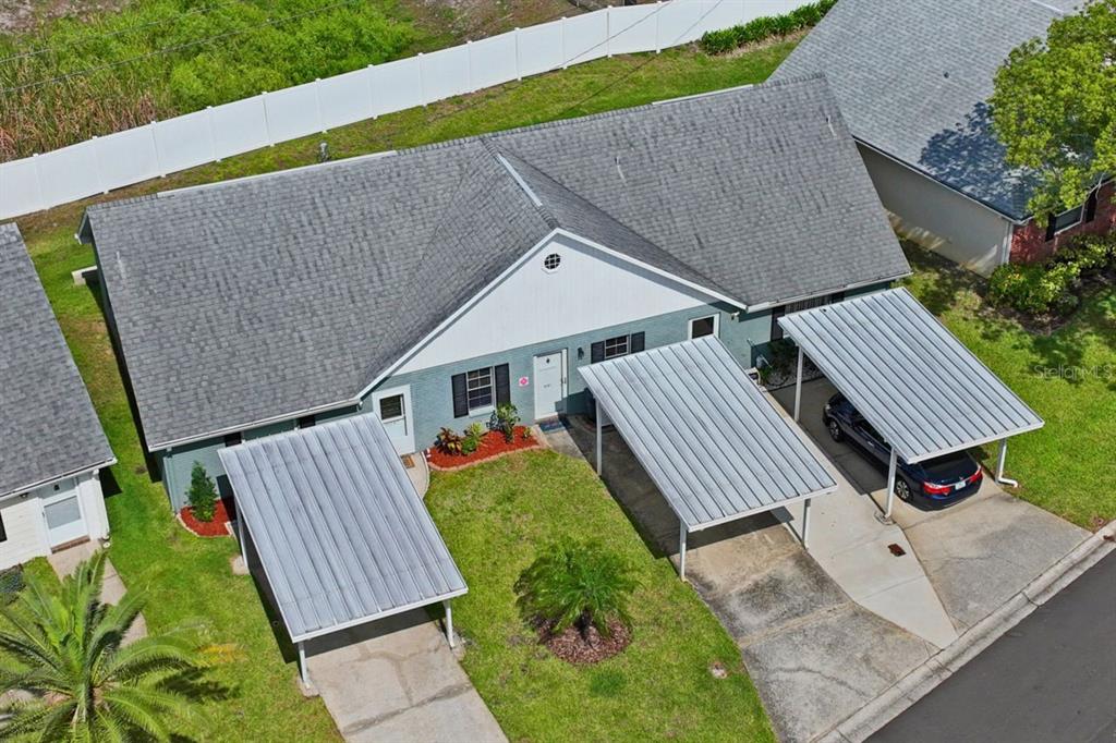 6101 Elmhurst Drive, Unit 5B New Port Richey, FL 34653 - Photo 28 of 45 an aerial view of a house with backyard and deck
