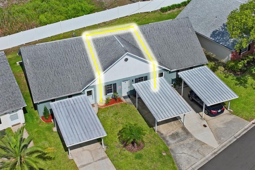 6101 Elmhurst Drive, Unit 5B New Port Richey, FL 34653 - Photo 29 of 45 an aerial view of a house with backyard and sitting area