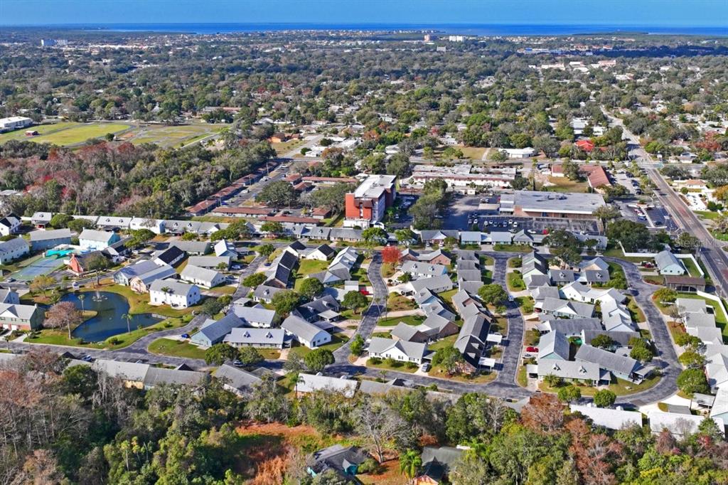 6101 Elmhurst Drive, Unit 5B New Port Richey, FL 34653 - Photo 45 of 45 an aerial view of residential houses with outdoor space