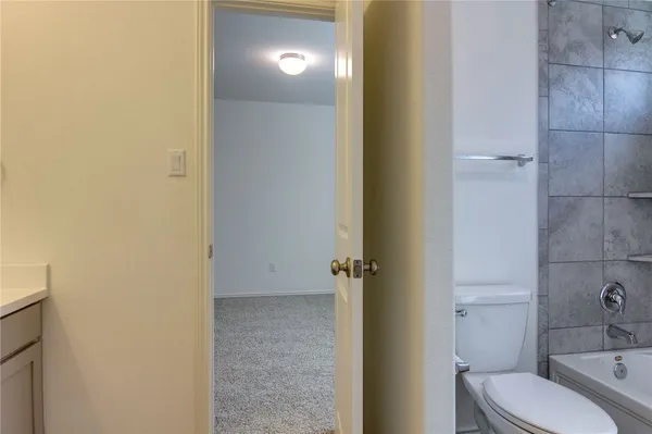 a bathroom with a sink and a large mirror