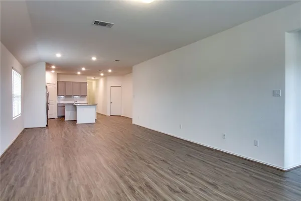 a view of kitchen with wooden floor