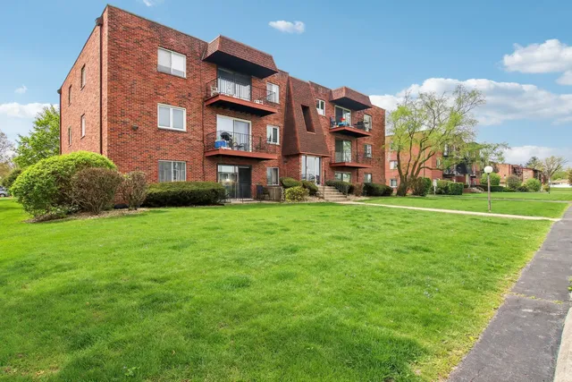 a view of a building with a yard