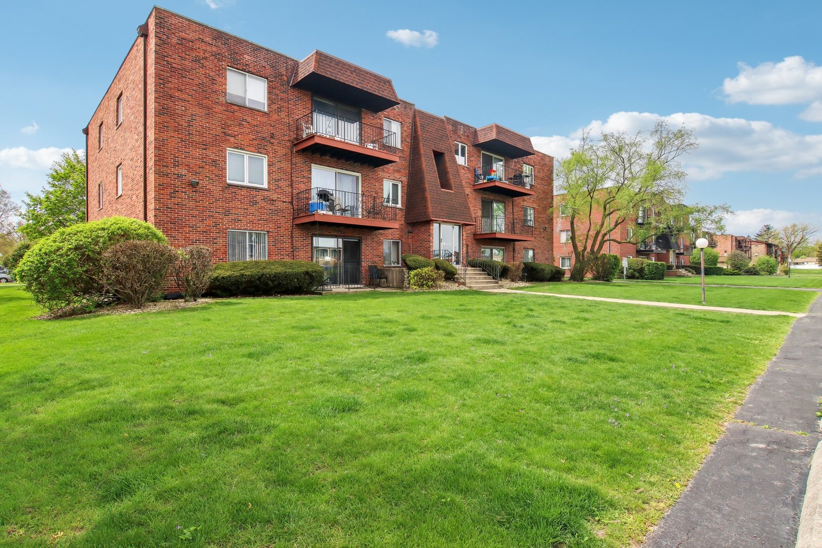 a view of a building with a yard