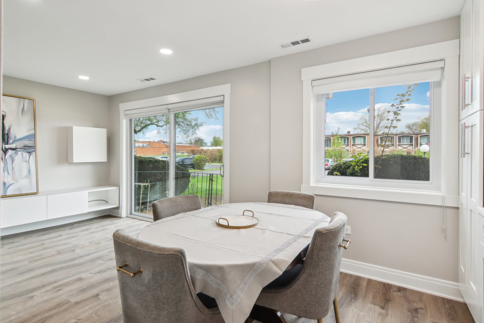 5704 West 128th Street, Unit 1C Crestwood, IL 60418 - Photo 21 of 29 a dining room with a large window and table