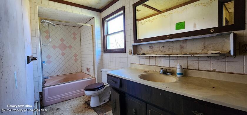 533 Main Street Gouldsboro, PA 18424 - Photo 11 of 13 a bathroom with a sink a toilet and shower