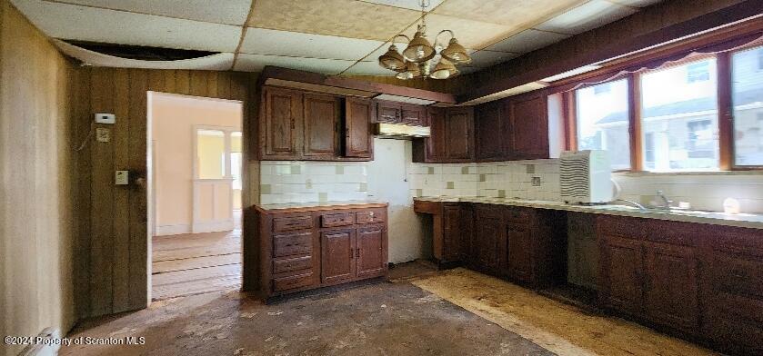 533 Main Street Gouldsboro, PA 18424 - Photo 6 of 13 a large kitchen with stainless steel appliances granite countertop a stove and cabinets