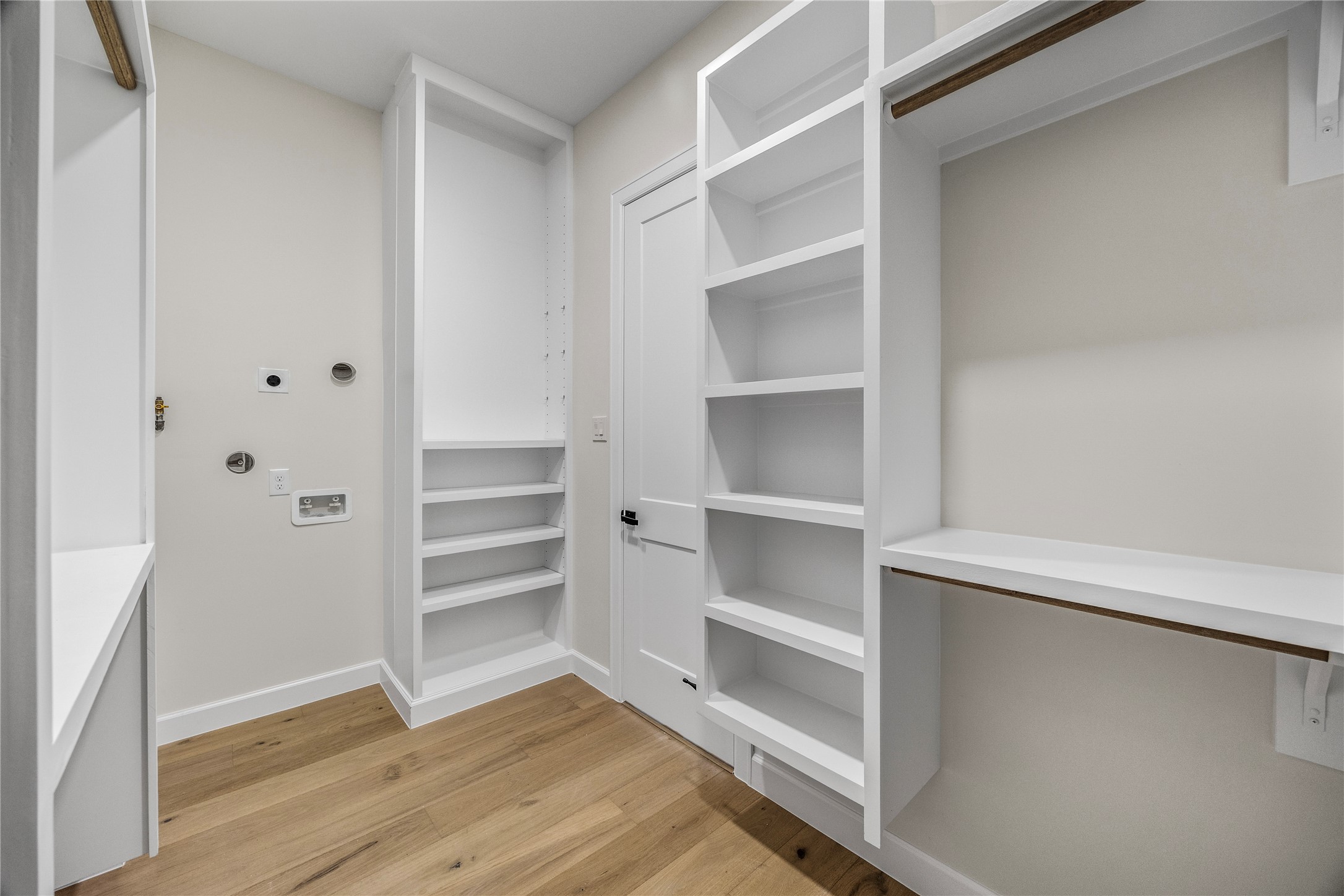 8646 Alcott Drive Houston, TX 77080 - Photo 20 of 44 a view of walk in closet with empty racks