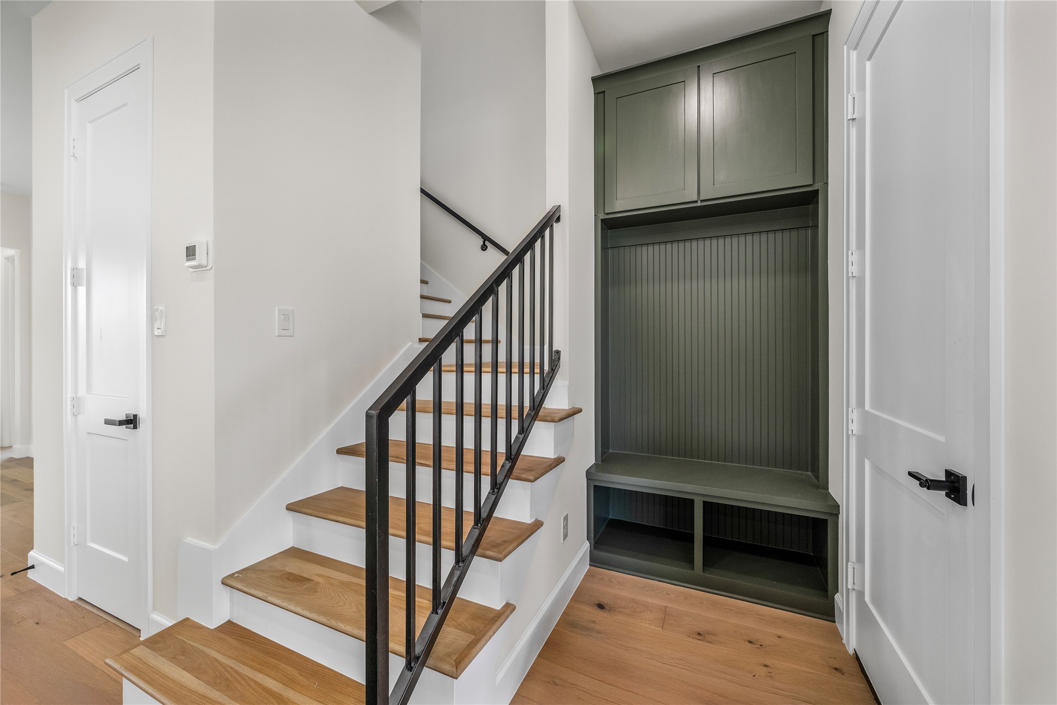 8646 Alcott Drive Houston, TX 77080 - Photo 21 of 44 a view of entryway with wooden floor and stairs