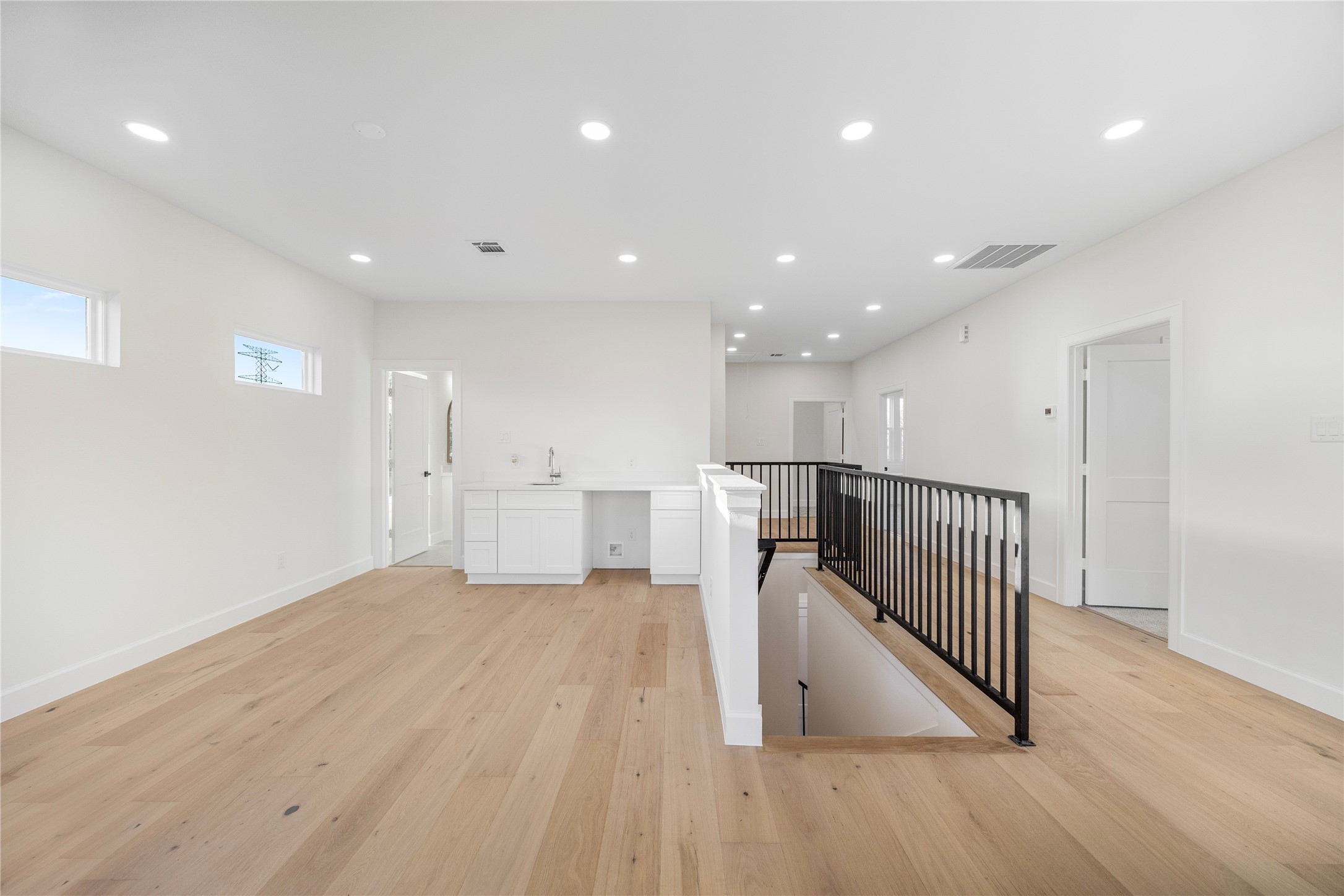 8646 Alcott Drive Houston, TX 77080 - Photo 22 of 44 a view of a hallway with wooden floor