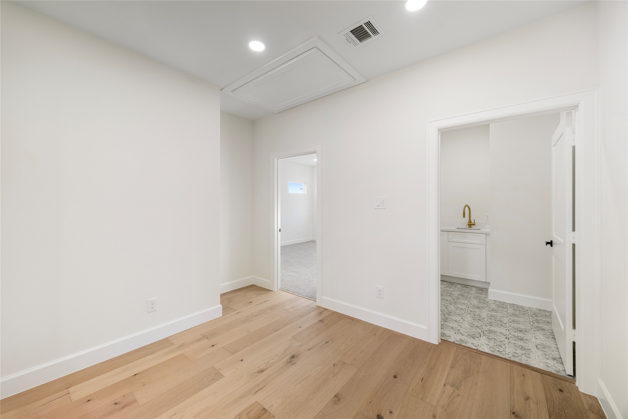8646 Alcott Drive Houston, TX 77080 - Photo 25 of 44 an empty room with wooden floor and entrance